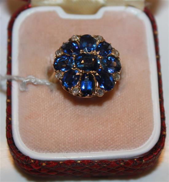 An 18ct gold sapphire and rose cut diamond cluster ring, size I.